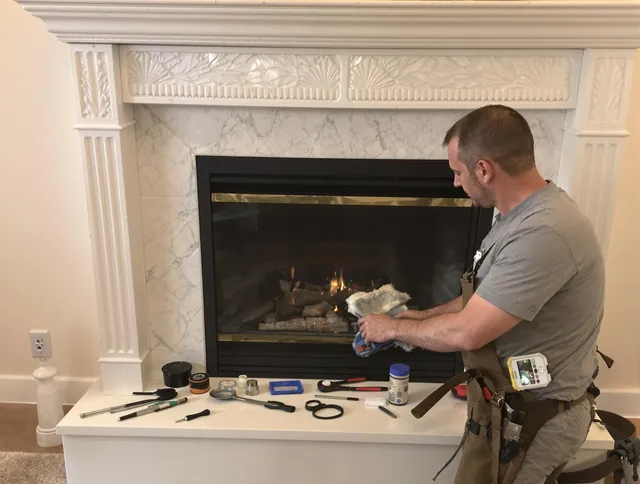 Burrillville Chimney Sweep performing fireplace maintenance in Burrillville, RI