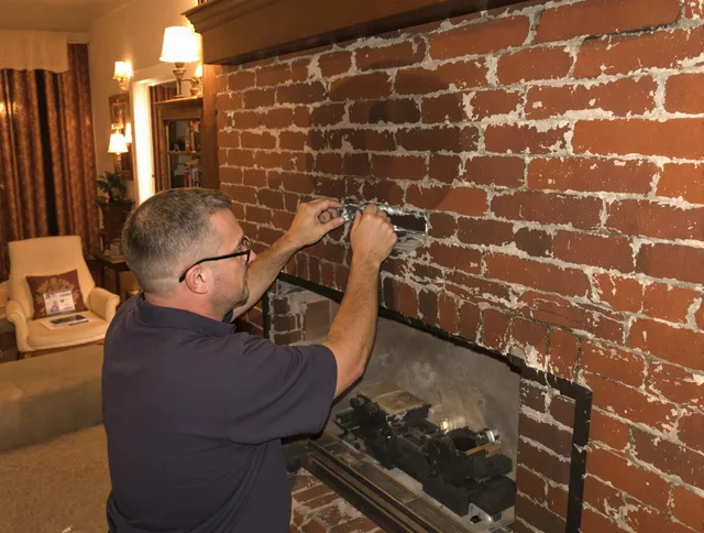 Burrillville Chimney Sweep expert fixing a fireplace in Burrillville, RI